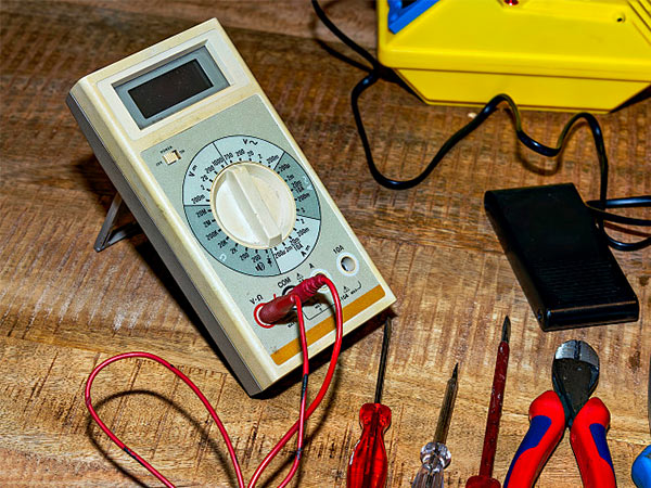Tabbed lithium coin cell battery for industrial electronics